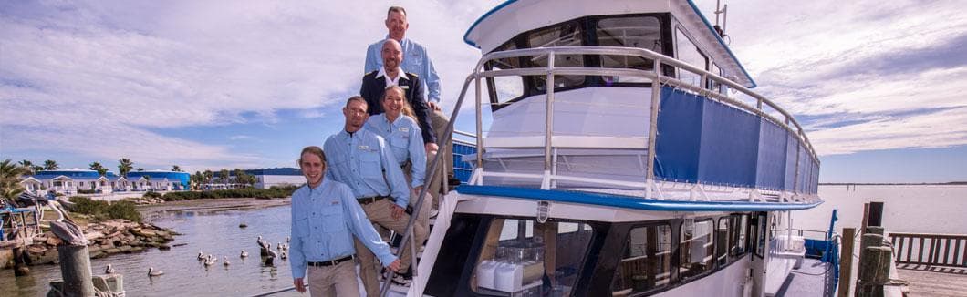 Group aboard large yacht enjoying panoramic harbor sightseeing cruise