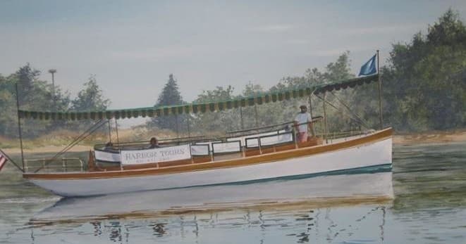 Scenic wooden launch cruising calm harbor waters near shore