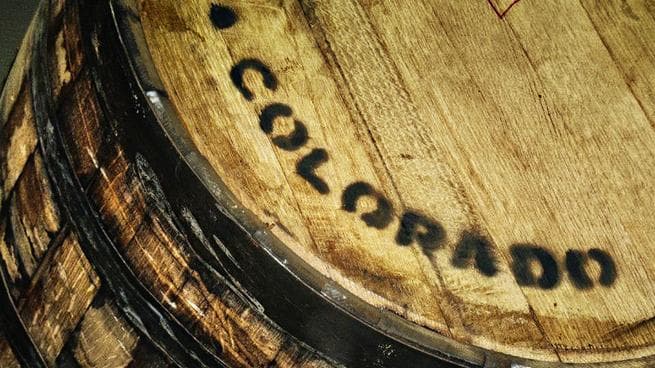 Aged oak beer barrel stamped Colorado at craft brewery
