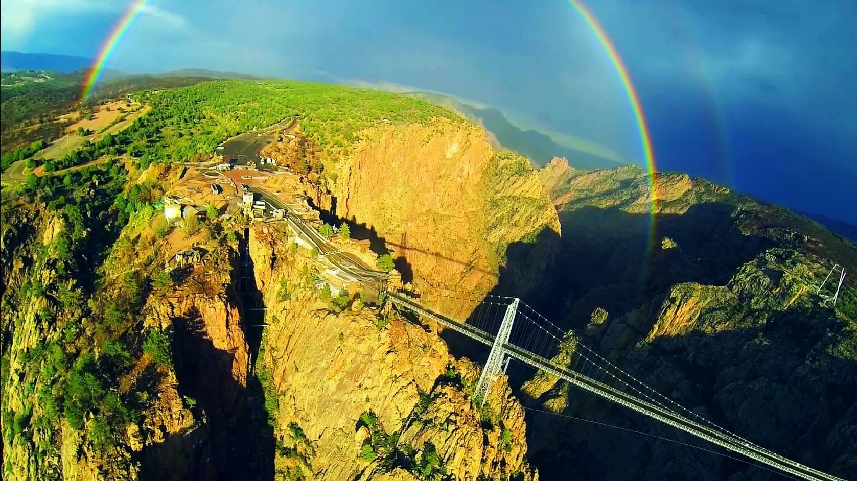 Helicopter tour over rainbow canyon and suspension bridge