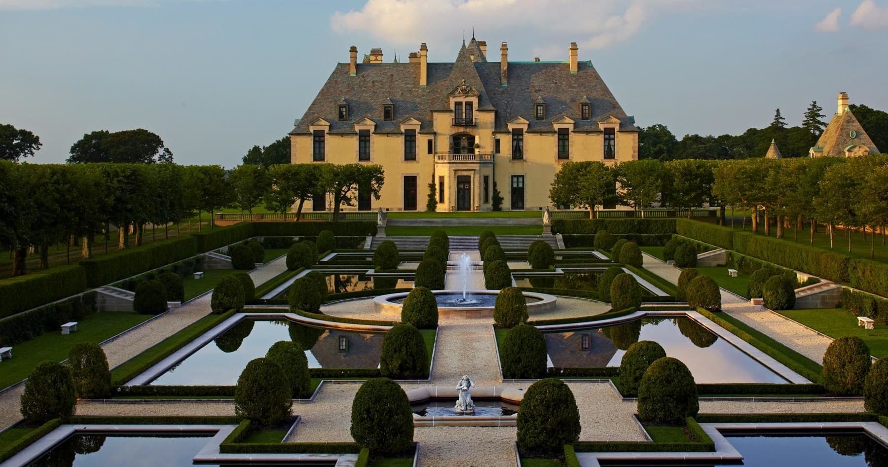 Formal French-style gardens and reflecting pools at Oheka Castle grounds