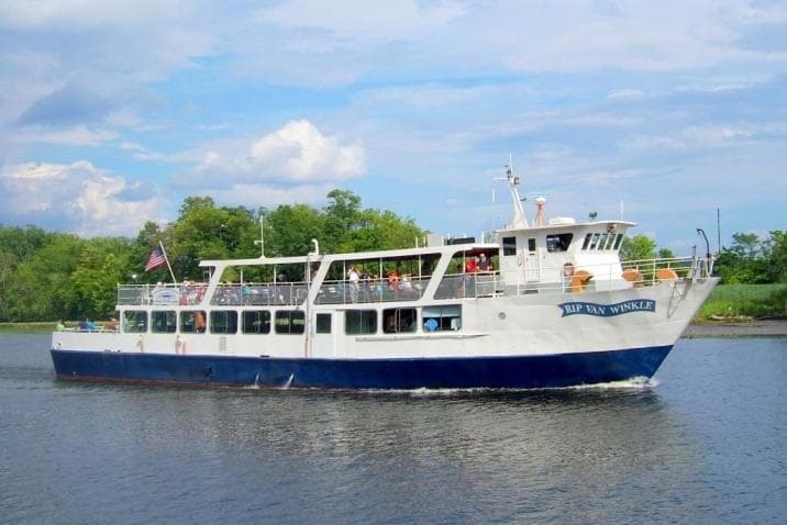 Sightseeing cruise boat underway on Hudson River with passengers
