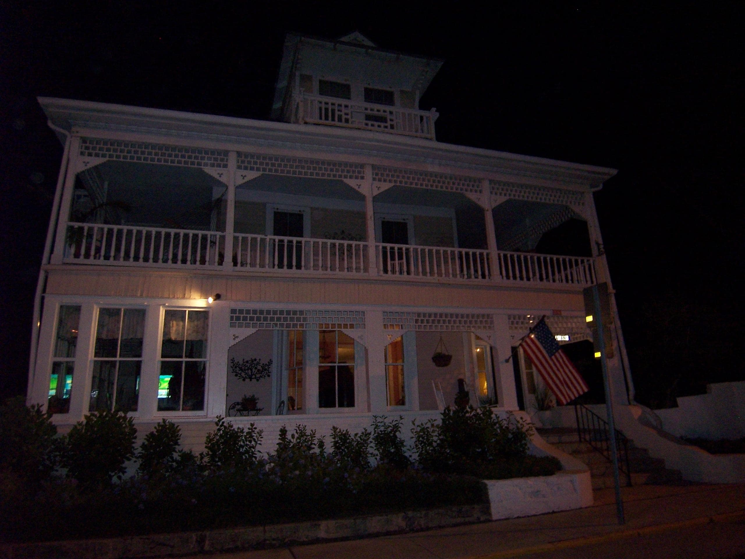 Victorian inn porch lit at night on St. Augustine ghost walk
