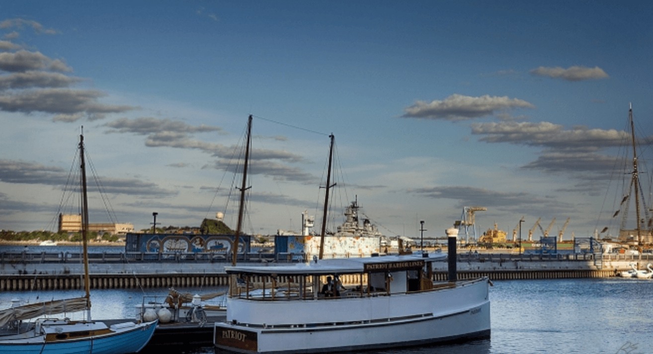Harbor sailboats moored under dramatic clouds in Philadelphia