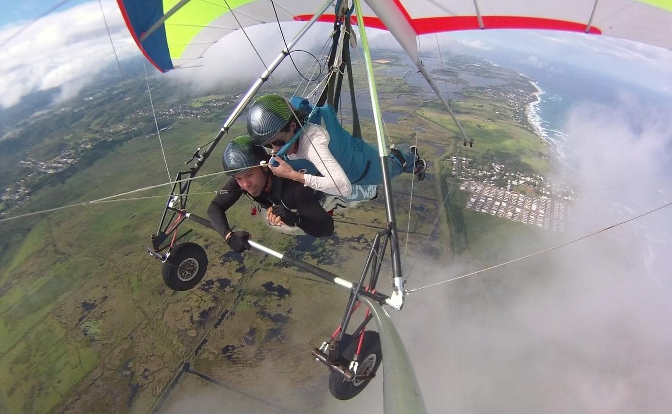 Microlight hang gliding over coastal Puerto Rico landscape