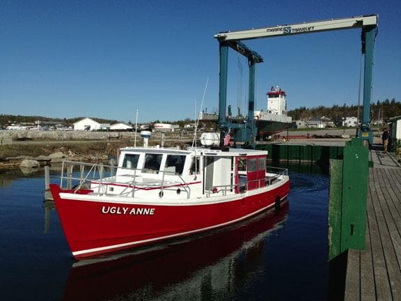Red tour boat docked at Mackinac harbor for sightseeing trips
