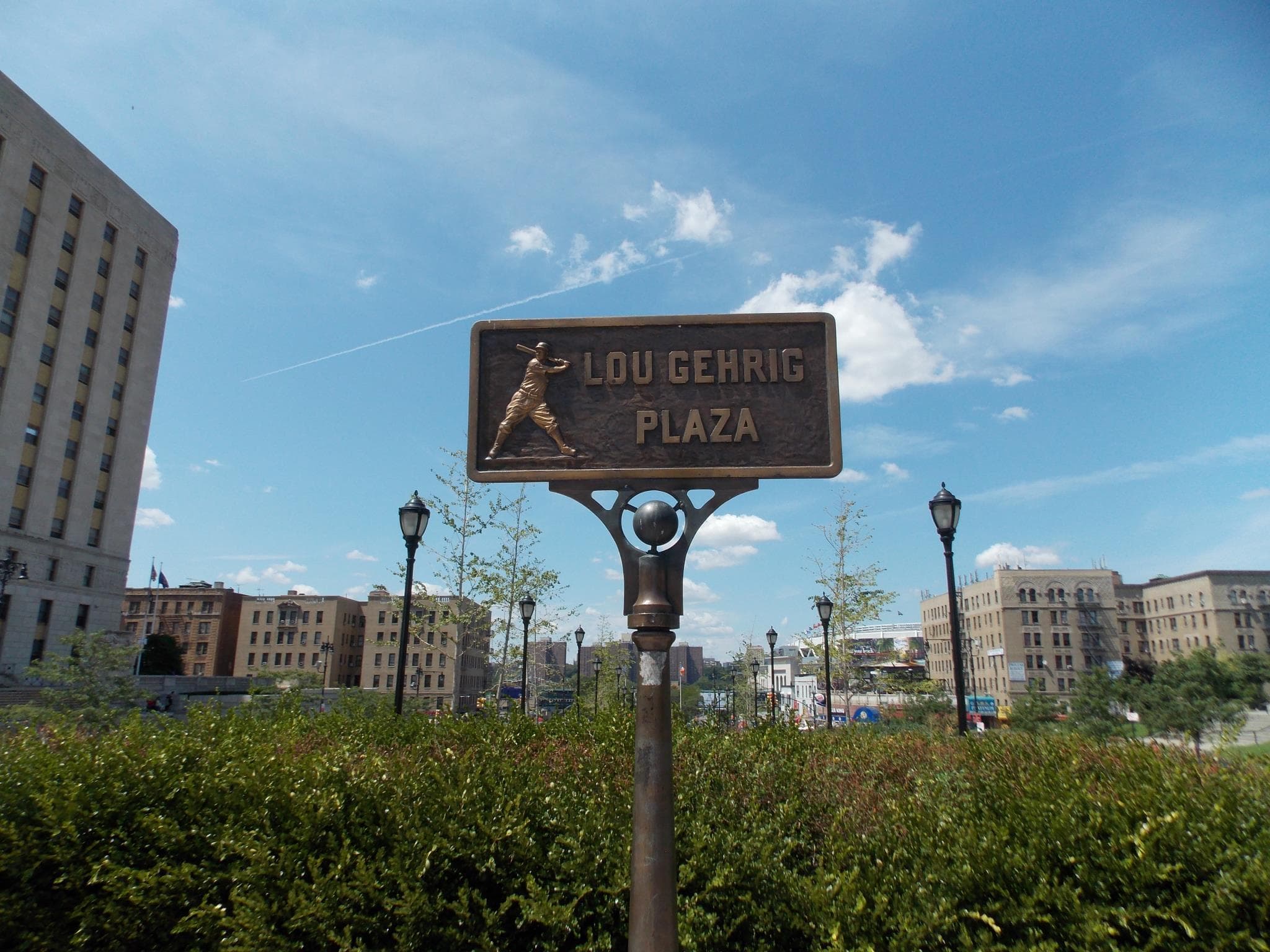 Lou Gehrig Plaza sign overlooking open park and skyline