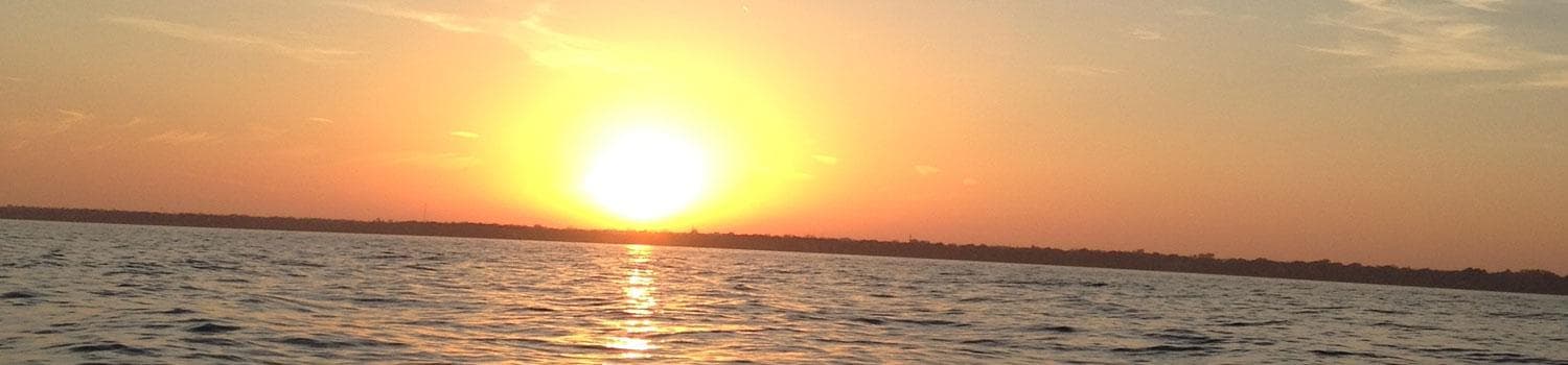 Sunset over Lake Michigan, wide horizon sailing view