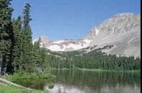 High alpine lake with mountain reflections, scenic Colorado basin