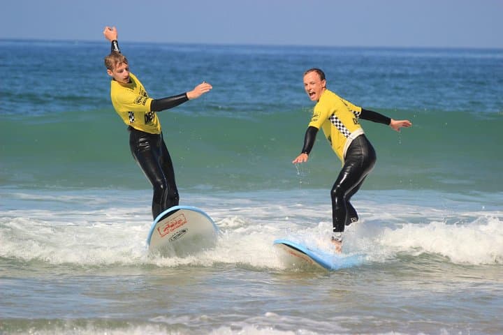 2-Hour Beginner Surf Lesson at Praia da Rocha, Portimão — Learn to Stand Up in Safe Waves