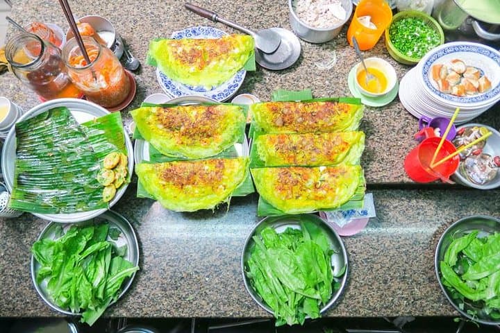 Saigon After Dark: Vespa Night Food Tour Through Chinatown and Saigon River photo 4