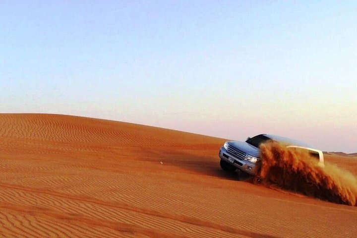 Dubai Sunrise Desert Tour: Sunrise Dune Drive & Sandboarding in the Arabian Desert photo 2