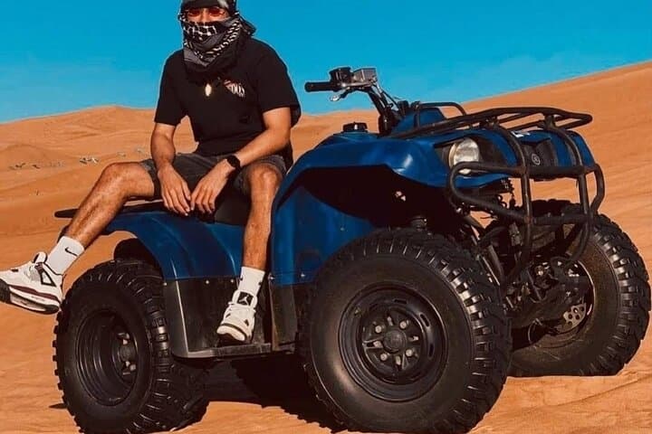 Dubai Desert Safari: Quad Bike, Camel Ride & BBQ Dinner Experience