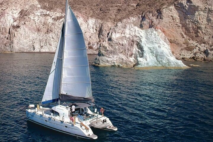 Santorini Catamaran Cruise: Red Beach, Hot Springs & BBQ Small-Group Sail photo 2