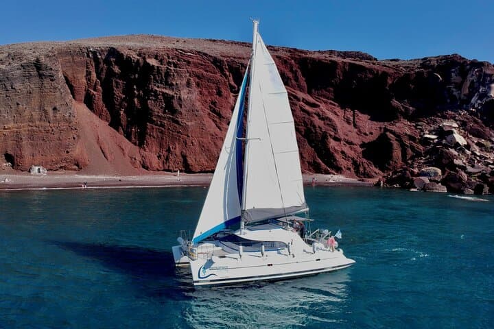 Santorini Catamaran Cruise: Red Beach, Hot Springs & BBQ Small-Group Sail photo 3
