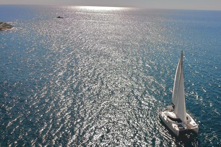 Santorini Catamaran Cruise: Red Beach, Hot Springs & BBQ Small-Group Sail photo 4