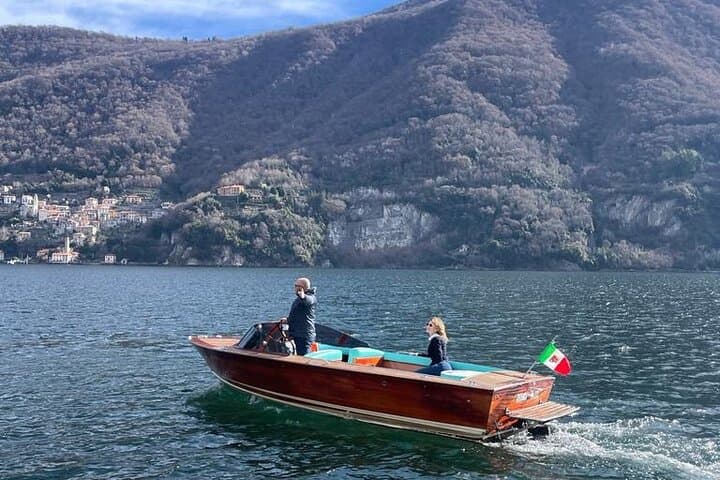 Vintage wooden motorboat cruise on Lake Como with open bar from Argegno