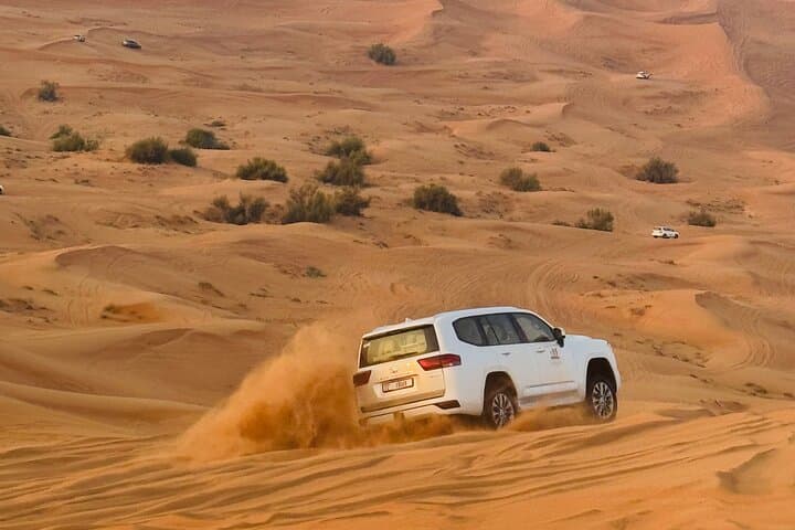 Private Morning Lehbab Red Sand Desert Safari — Camel Ride & Sandboarding photo 3