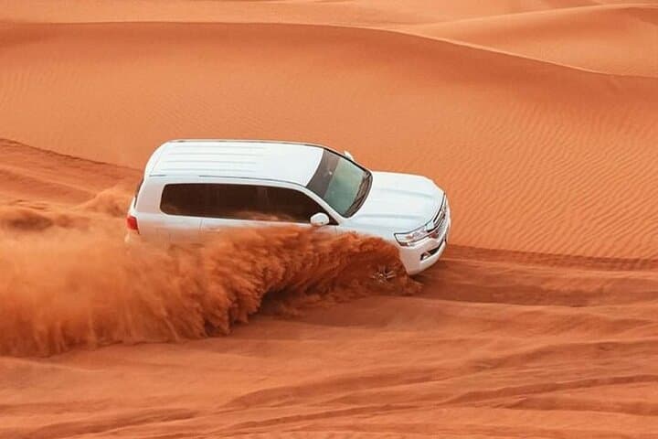 Evening Desert Safari Dubai: Dune Bashing, Camel Rides & BBQ Camp