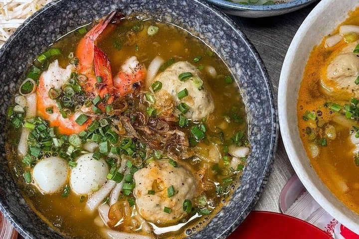 Saigon by Night: Scooter Street-Food Tour Through District 1 & Chinatown photo 1