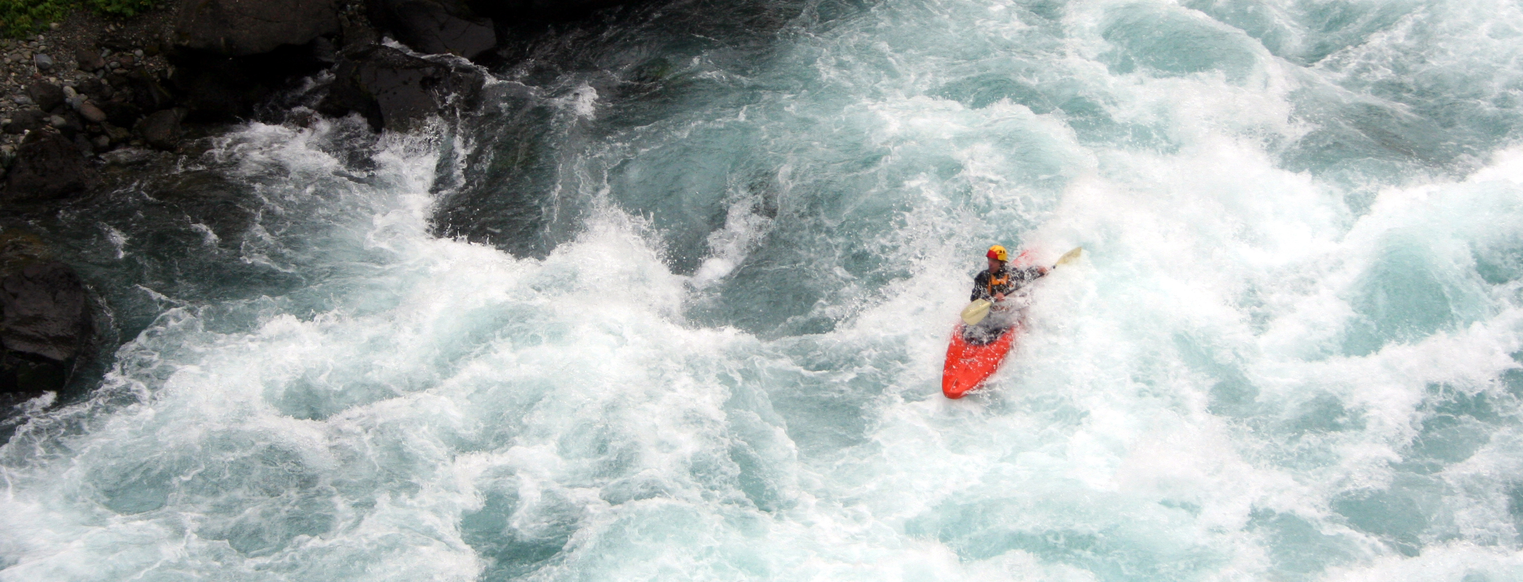 Kayaker in whitewater rapids